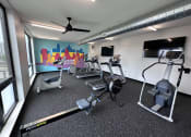 Thumbnail 5 of 81 - Modern gym with rows of cardio equipment.